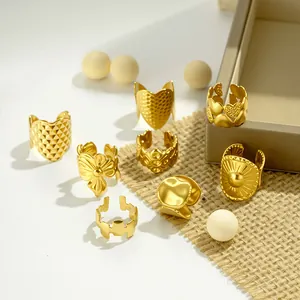 Collection of gold stainless steel non-piercing ear cuffs with geometric and floral designs