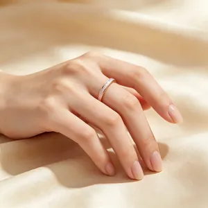 Minimalist 2mm stainless steel ring with shell inlay on model's finger
