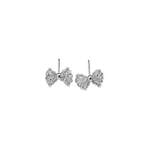 Korean style minimalist silver bow stud earrings with delicate metallic texture