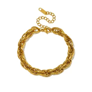 Macro detail of a chunky gold-tone twisted chain stainless steel bracelet for women