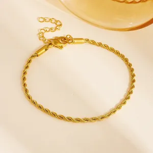 Detailed view of a gold rope chain bracelet with lobster clasp and extension