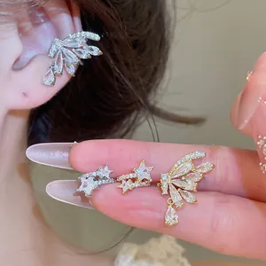 Detail showing elegant 18k gold plated butterfly and star zirconia ear cuffs