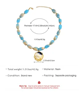 Detailed view of blue and white marble resin bead necklace with shell pendant and dimensions.