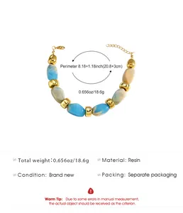 Blue and white marbled resin bead bracelet with gold spacers and size details