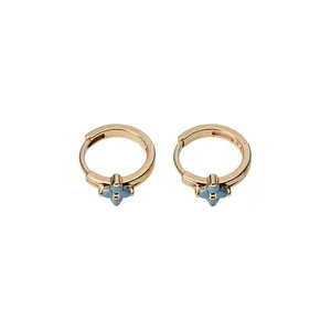 Elegant gold-plated hoop earrings featuring a dainty light blue flower charm