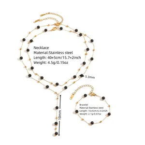Detailed view of gold stainless steel necklace and bracelet set with size measurements