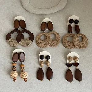 Close-up macro view of Bohemian earrings collection featuring wooden and straw woven details