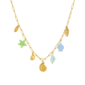 Close-up of gold-plated conch necklace with colorful starfish and turtle pendants