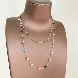 Detail of colorful double-layered necklace with irregular glass beads in summer style.