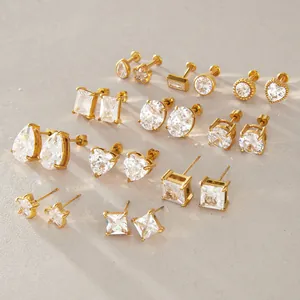 Detailed view of various gold-plated stainless steel stud earrings with clear cubic zirconia.