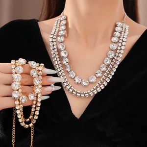 Detailed macro view of sparkling multi-layer rhinestone collar necklace and matching jewelry