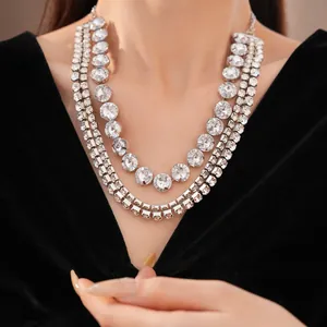 Detailed close-up of a luxury triple-strand necklace with round crystal rhinestones