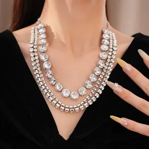Close-up detail of a palace style multi-layer sparkling rhinestone necklace worn on a model