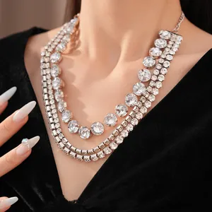 Close-up detail of an elegant multilayer rhinestone choker necklace on a black dress