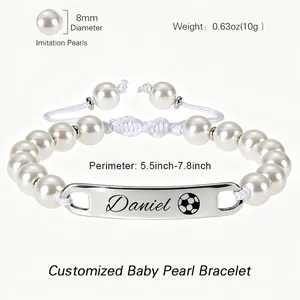 Detailed macro view showing 8mm imitation pearls and engraved stainless steel