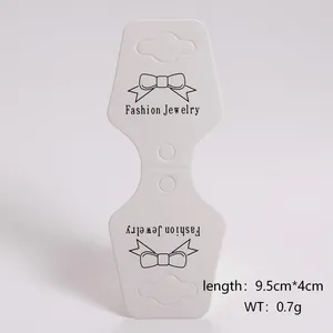 White folding jewelry display card detail with bow design and dimensions.