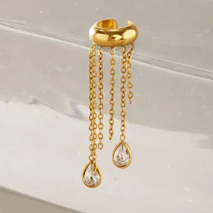 Close-up of gold stainless steel ear cuff with chain tassels and teardrop crystals