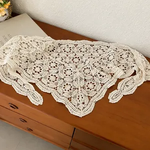 Vintage white crocheted lace triangular scarf belt with hollow floral pattern for women.