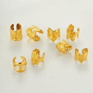 Set of 8 gold stainless steel non-piercing ear cuffs with floral and mask designs