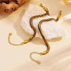 Detailed view of leopard print gold stainless steel flat snake chain bracelets