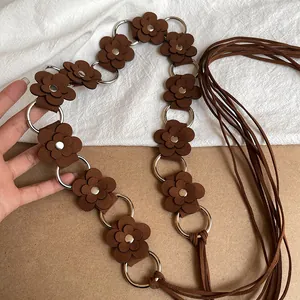 Bohemian style brown suede flower waist chain with metal rings and fringe ties.