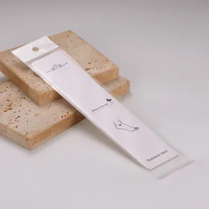 Detail view of long white jewelry display card with OPP bag for anklets or necklaces