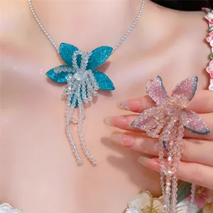 Detail view of French flower tassel necklace and pendant jewelry set on a model