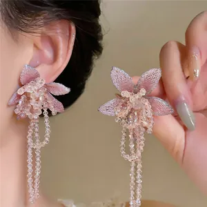 Exquisite close-up of French style pink floral tassel earrings featuring crystal beads