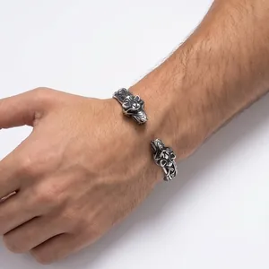 Vintage stainless steel men's open cuff bracelet with double wolf head design.