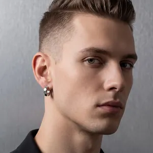 Close-up detail showing the faceted diamond cut of a 13mm silver titanium steel hoop earring