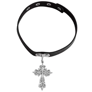 Close-up of gothic vintage carved cross pendant on black leather choker necklace