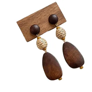 Bohemian wooden teardrop earrings with raffia woven beads and circular wood studs