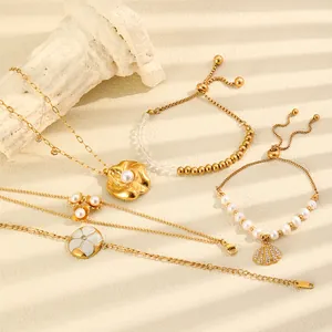 Macro detail of high-end 18K gold titanium steel necklace and bracelet with shell motif