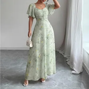 Light green floral maxi dress with square neckline and short flutter sleeves shown on a model.