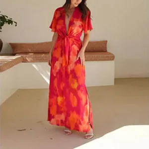 Lifestyle view of a summer fashion abstract print tie-front top and slit maxi skirt set