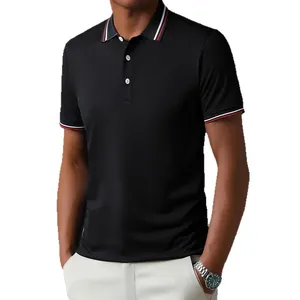 Close-up detail of black men's short sleeve Polo shirt featuring striped collar and cuffs