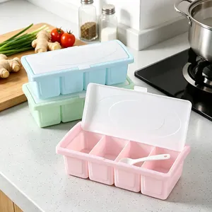 Detail view of 4-compartment plastic seasoning box set in pink, blue, and green colors.