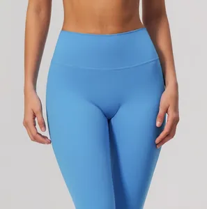 Detail view of high-waisted blue yoga leggings featuring a seamless front design for comfort
