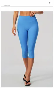 Model wearing high-waisted seaside blue yoga capri leggings for fitness and running