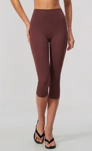 Close-up detail of high-waisted burgundy yoga capri leggings featuring soft brushed fabric