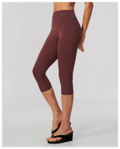 Close-up detail of high-waisted brushed yoga capris in burgundy color for women fitness