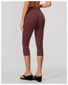 Back view of high-waisted burgundy yoga capri leggings showing slim fit and texture