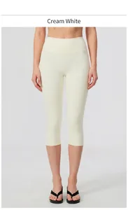 Front view of high-waisted brushed yoga capri pants in creamy white color