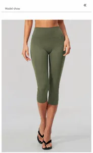 Detailed macro view of forest green high-waisted brushed yoga capris for fitness