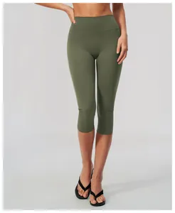 Detailed macro view of women's olive green high-waist brushed yoga capri pants