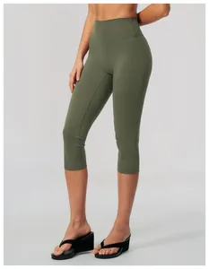 High-waisted olive green yoga capris for women, slim fit athletic leggings for fitness.