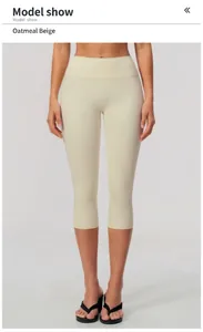 Detail view of high-waist oatmeal yoga capri leggings for fitness and running