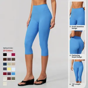 High-waisted blue yoga capri leggings with seamless front and butt-lifting design