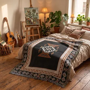 Cozy bohemian geometric pattern throw blanket with fringe edge in artistic bedroom