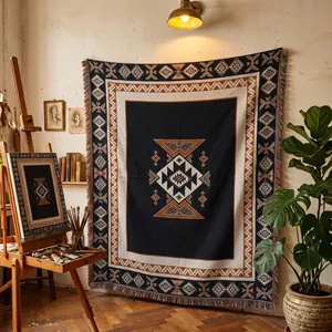 Woven Bohemian blanket with geometric patterns hanging in an artistic studio setting